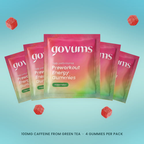 Five Govums single-serve watermelon energy gummy packs fanned out, with loose gummies. 100mg caffeine from green tea, 4 gummies per pack.