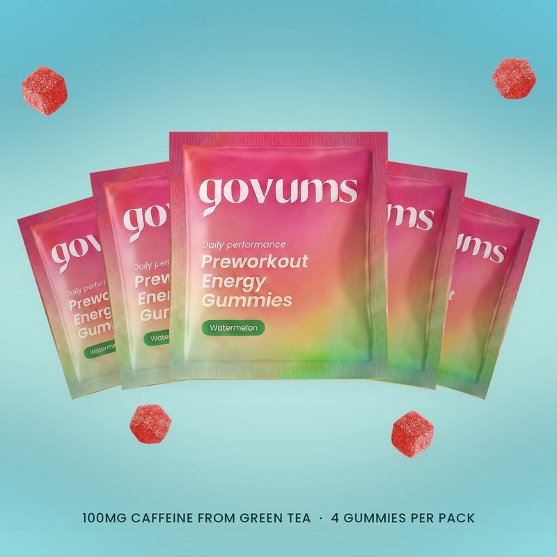 Five Govums single-serve watermelon energy gummy packs fanned out, with loose gummies. 100mg caffeine from green tea, 4 gummies per pack.