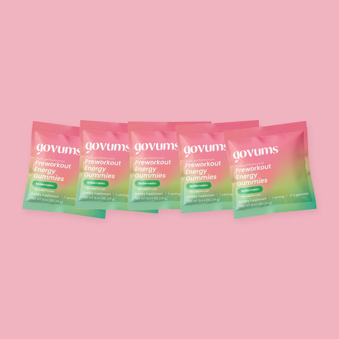 Five individually packaged Govums watermelon energy gummy servings fanned out on a pink background
